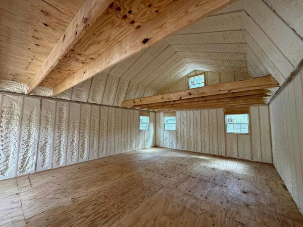 Open-cell spray foam insulation on a gambrel roof loft in a Corrigan, TX residential home