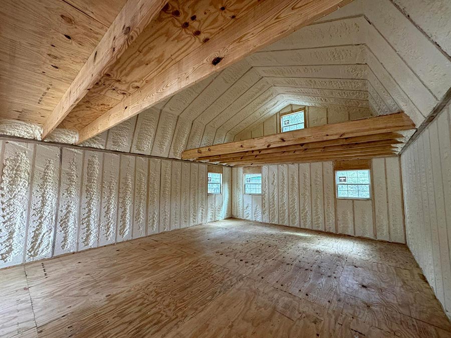 Open-cell spray foam insulation on a gambrel roof loft in a Corrigan, TX residential home